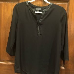 Dressy black blouse with faux leather detail